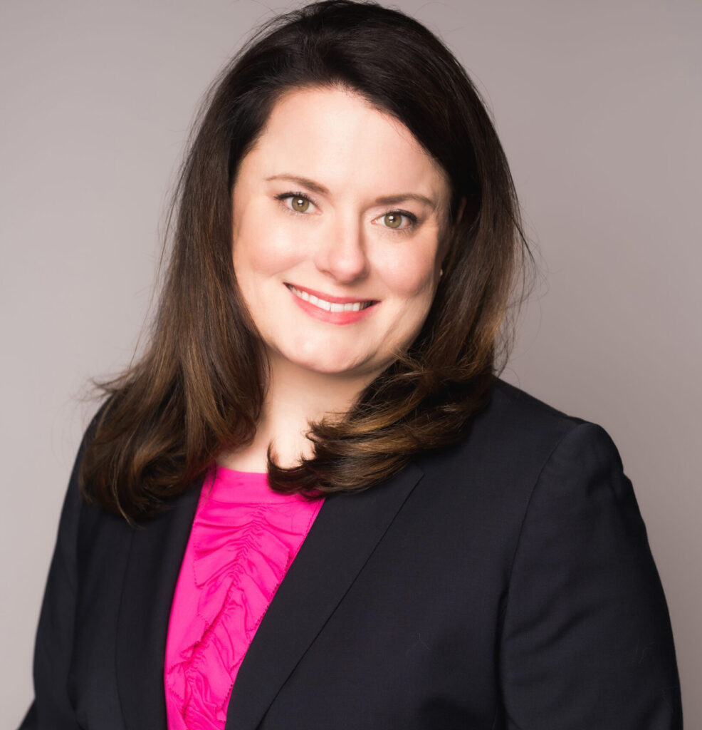 Headshot of Julia Clayton. Smiling